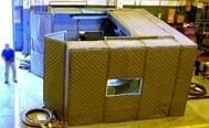 KABTech custom noise enclosure on the warehouse floor.