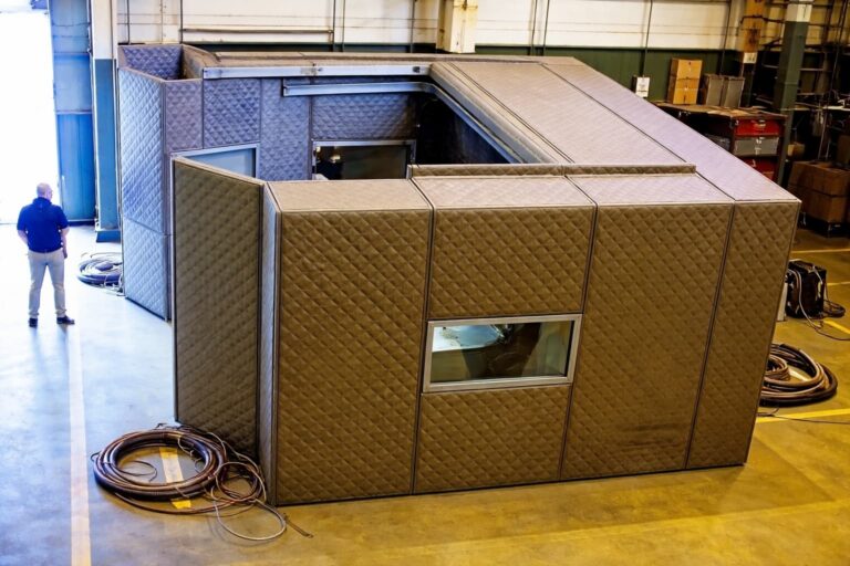 KABTech custom noise enclosure on the warehouse floor.