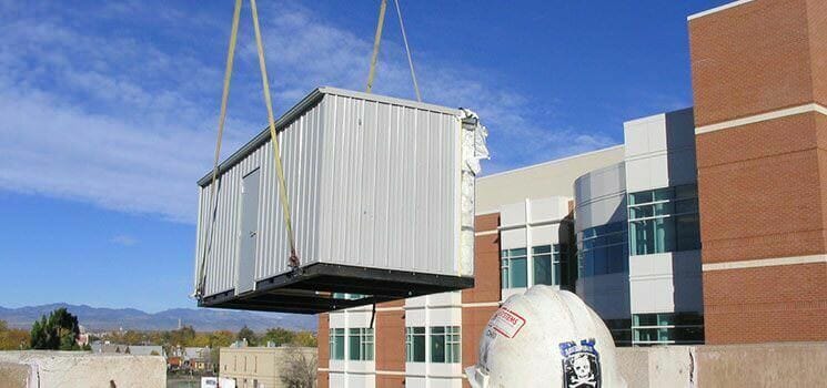 Crane lift base pump enclosures