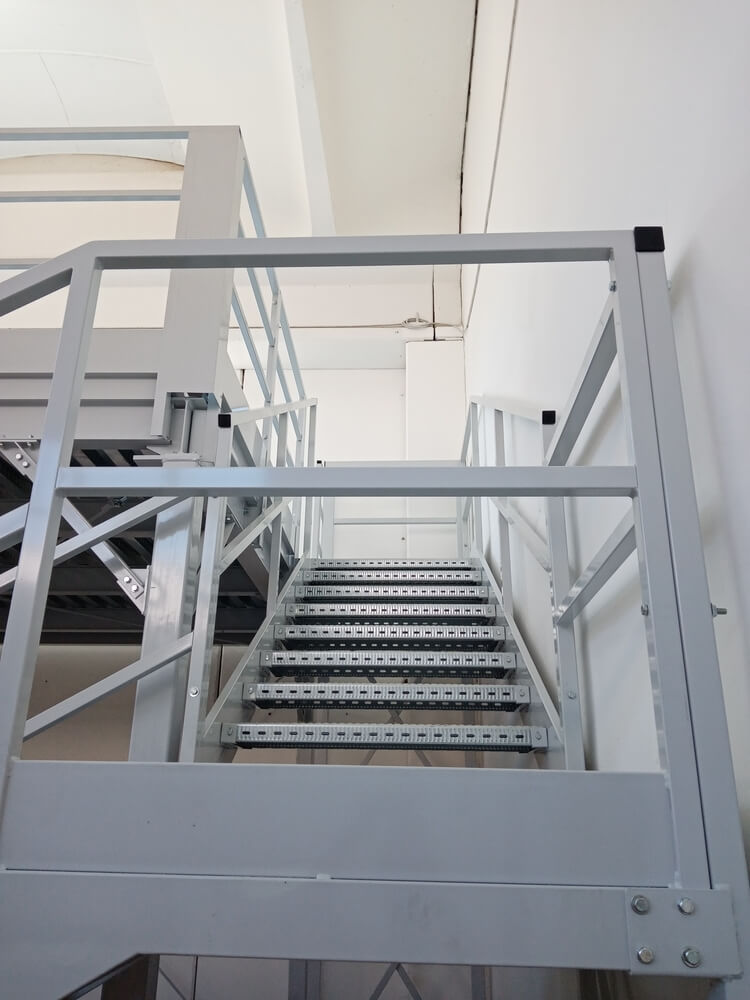 Ground shot of an industrial mezzanine's steel structure.