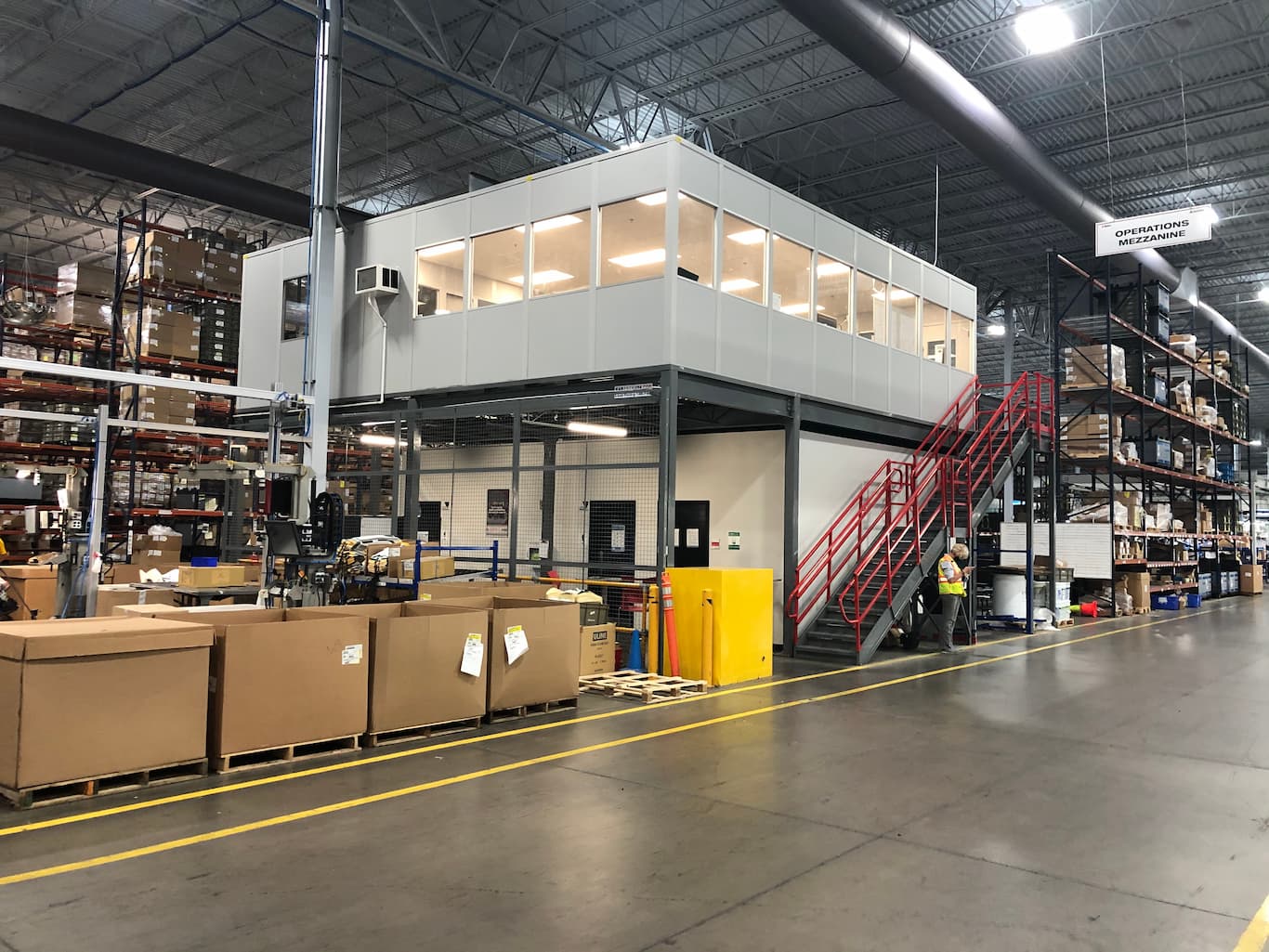 Modular office and mezzanine system used for operations in a warehouse setting