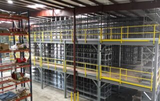 A multi-floor warehouse mezzanine structure next to another mezzanine