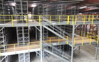 The side of a multi-floor steel warehouse mezzanine