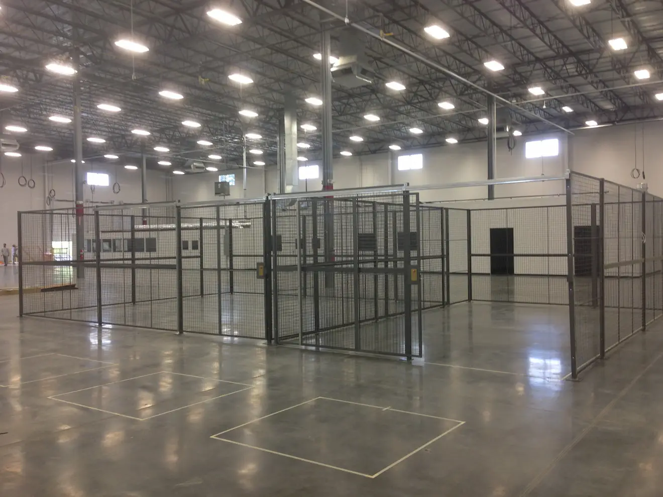 Full view of a large custom built wire mesh partition by KABTech Corp