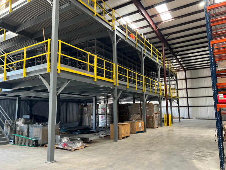 Multi-level production mezzanine with yellow safety railings