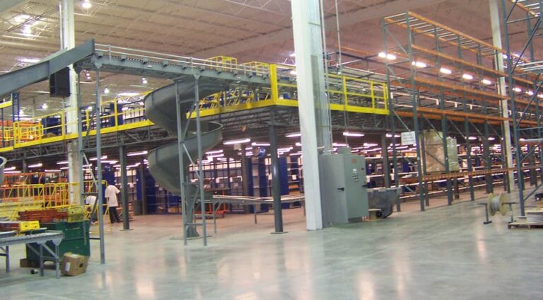 A mezzanine structure with a conveyor support system built in, installed by KABTech Corp