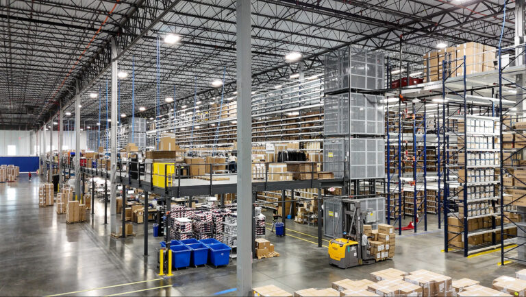 Multi-level mezzanine with tons of boxes and items in storage