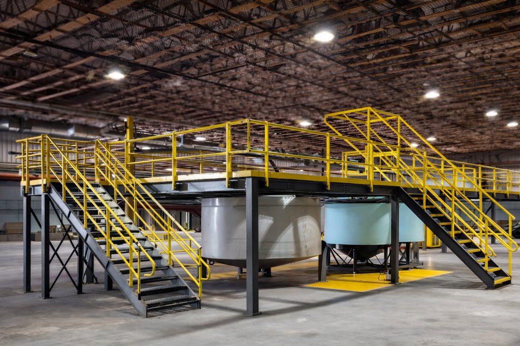 Industrial Tank Access Platform with Yellow Staircase
