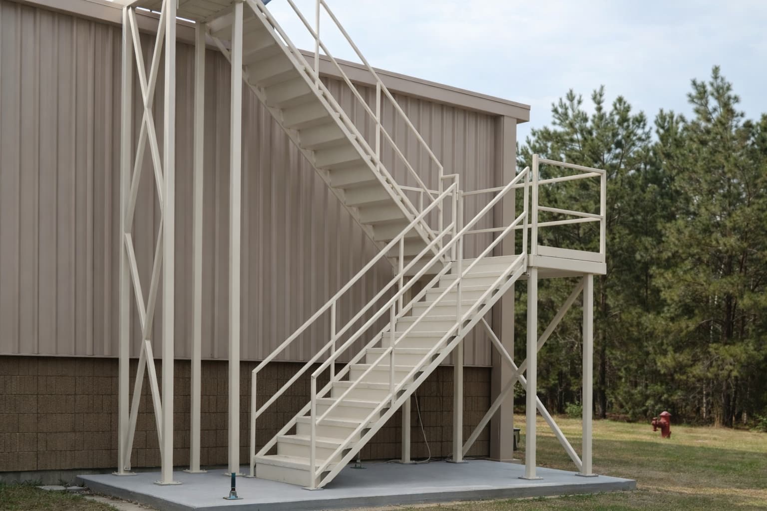 Stairway leading to a secure raised walkway in use for warehouse operations