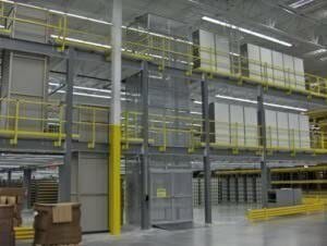 Vertical Material Lift Attached to a Two Floor Warehouse Mezzanine
